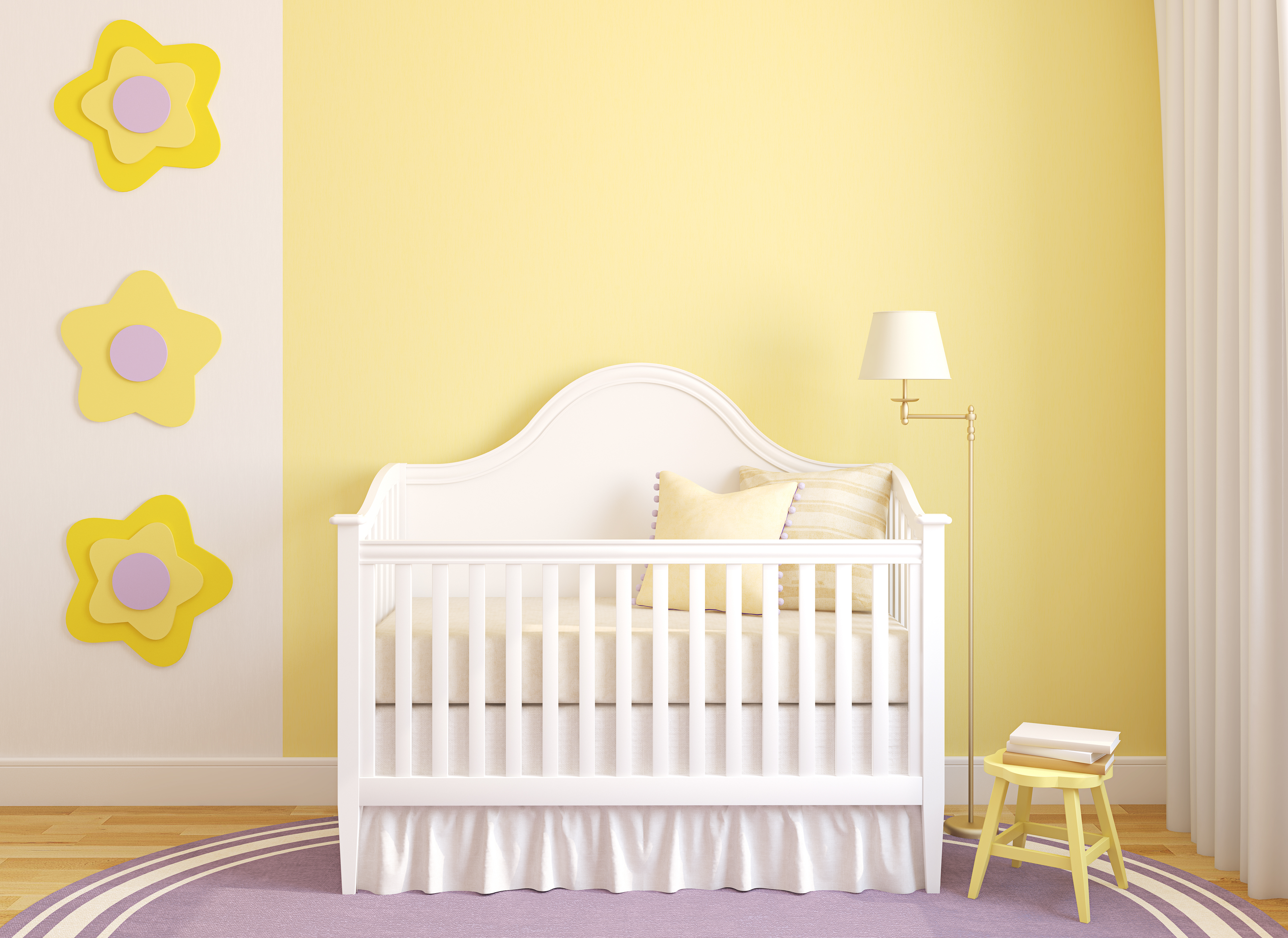 Sunny yellow painted nursery with floral decals and white crib